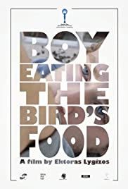 Boy Eating the Bird's Food Boy Eating the Bird's Food